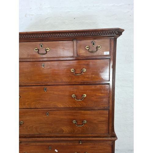 1001 - A George III mahogany chest on chest with three short drawers, six long drawers, brushing slide, bra... 