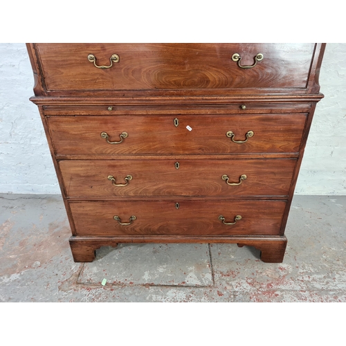 1001 - A George III mahogany chest on chest with three short drawers, six long drawers, brushing slide, bra... 