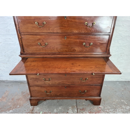 1001 - A George III mahogany chest on chest with three short drawers, six long drawers, brushing slide, bra... 