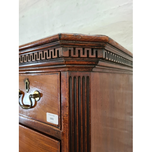 1001 - A George III mahogany chest on chest with three short drawers, six long drawers, brushing slide, bra... 