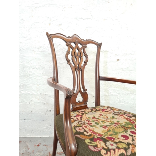 1006 - A 19th century mahogany carver dining chair with tapestry seat, carved fretwork back and ball and cl... 