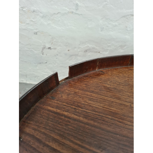 1008 - An Edwardian mahogany oval side table - approx. 48cm high x 45cm wide x 61cm long