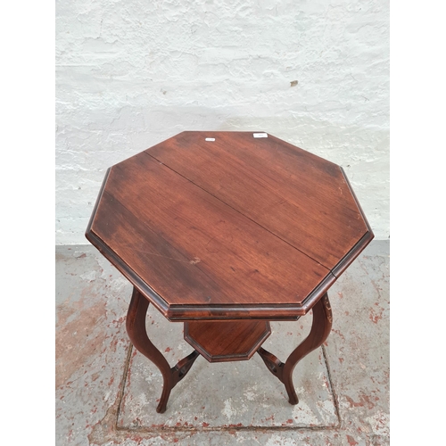 1009 - An Edwardian mahogany octagonal two tier side table - approx. 76cm high x 58cm wide x 60cm long