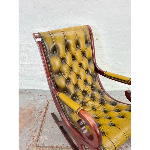 1024 - A Chesterfield mustard leather and mahogany slipper rocking chair - approx. 98cm high x 58cm wide x ... 