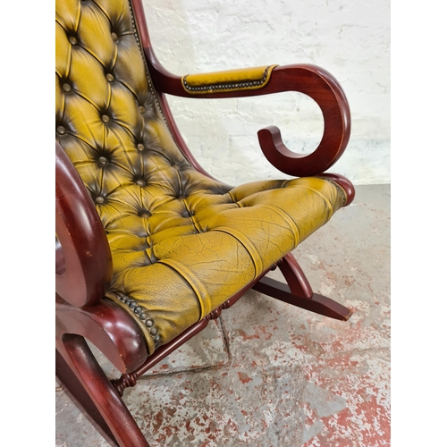 1024 - A Chesterfield mustard leather and mahogany slipper rocking chair - approx. 98cm high x 58cm wide x ... 