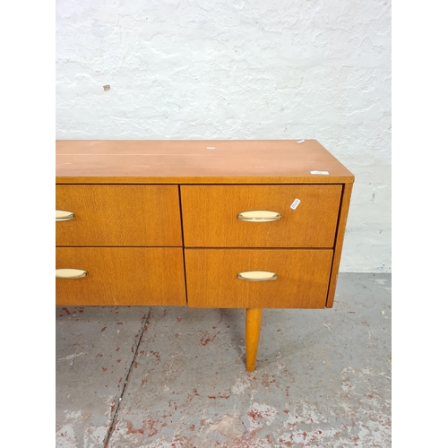 1028 - A mid 20th century Ranella 'only at Lewis's' teak chest of six drawers - approx. 64cm high x 137cm w... 