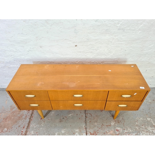 1028 - A mid 20th century Ranella 'only at Lewis's' teak chest of six drawers - approx. 64cm high x 137cm w... 