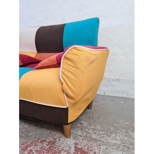 1036 - A modern retro style patchwork upholstered two seater sofa - approx. 92cm high x 144cm wide x 75cm d... 