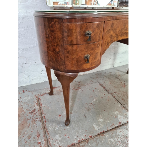 1038A - A mid 20th century Golden Key walnut kidney shaped dressing table with three section bevelled edge m... 