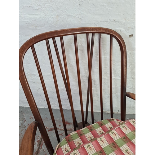 1039 - An Ercol windsor elm and beech armchair