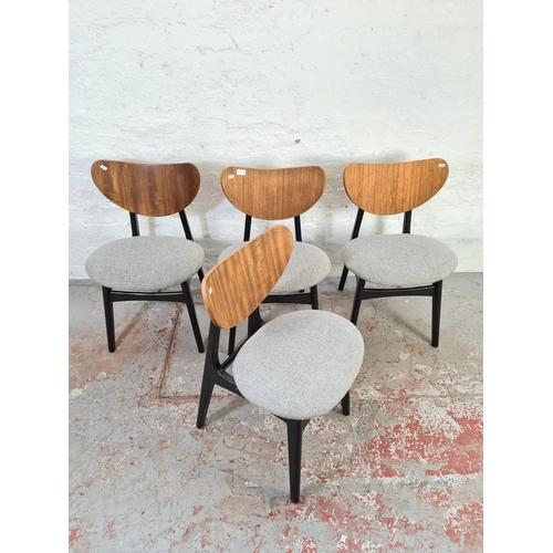 1041 - A set of four G Plan E Gomme Librenza tola wood dining chairs with grey upholstery and ebonised supp... 