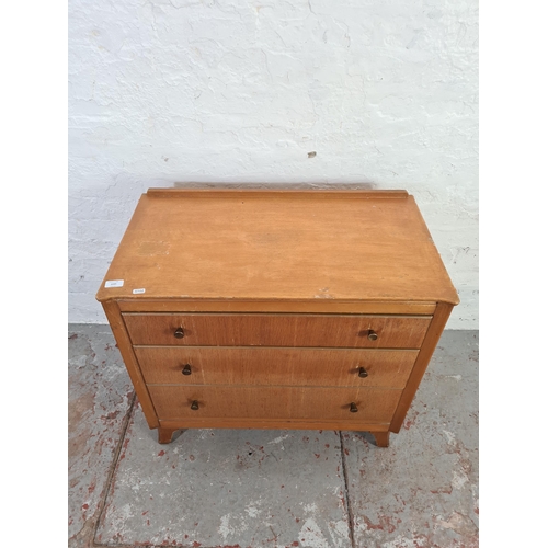 1045 - A mid 20th century Lebus oak chest of three drawers - approx. 72m high x 78cm wide x 43cm deep