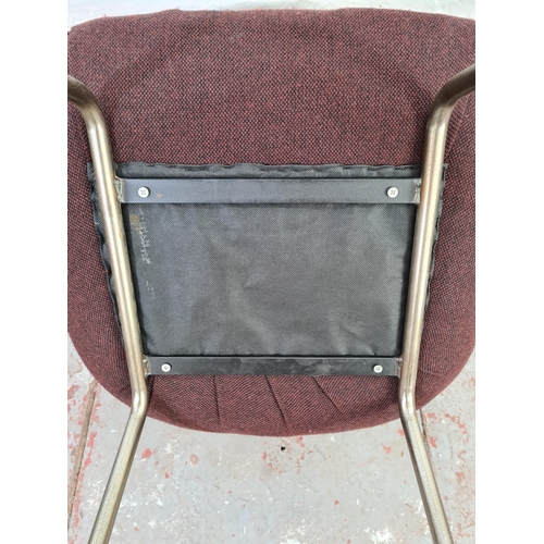 1046 - A mid 20th century brown upholstered tub chair on chrome supports