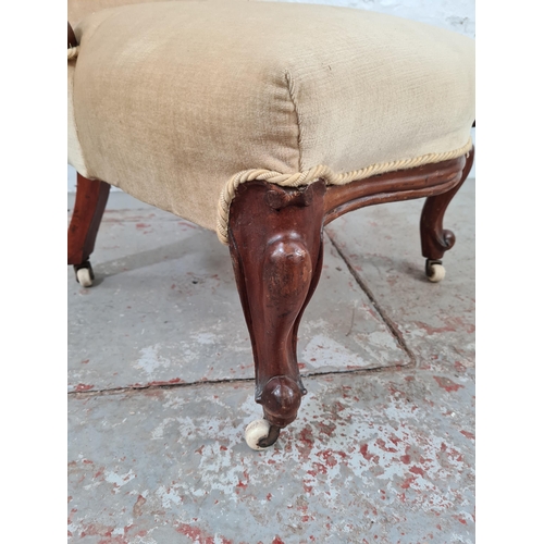 1052 - A Victorian mahogany and beige upholstered spoon back nursing/bedroom chair - approx. 94cm high x 55... 