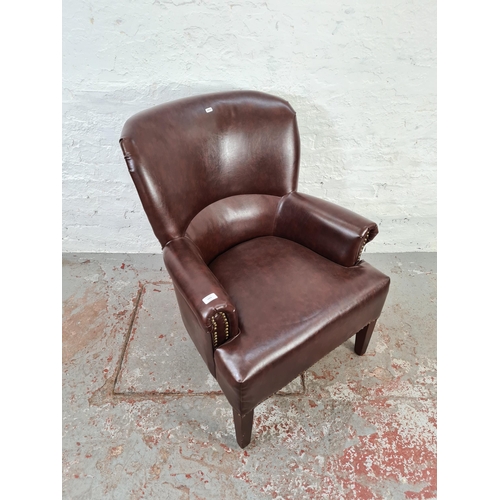 1053 - A Victorian style brown leather brass studded armchair - approx. 92cm high x 68cm wide x 70cm deep