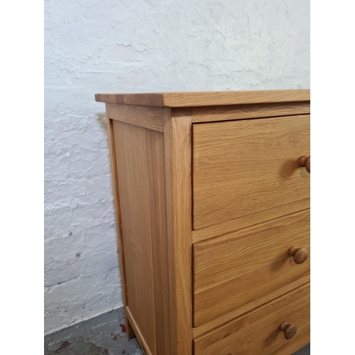 1056 - A modern oak chest of six drawers - approx. 79cm high x 120cm wide x 40cm deep