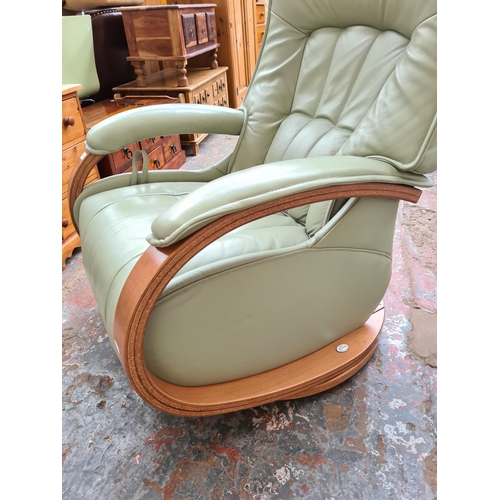 1064 - A Himolla Cumuly range green leather and beech reclining armchair - approx. 110cm high x 73cm wide x... 