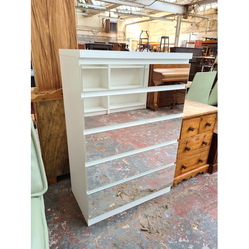 1065 - A modern white and mirrored glass chest of two short over four long drawers - approx. 104.5cm high x... 