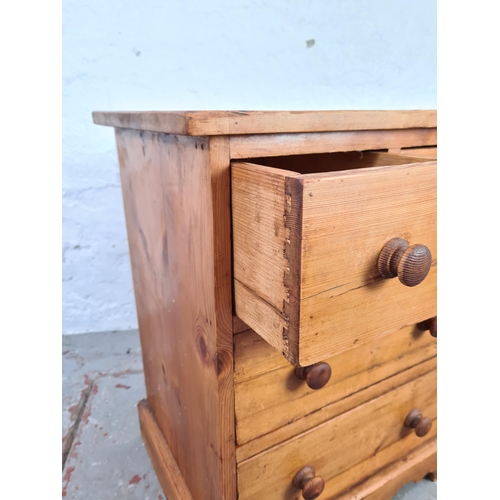 1066 - A modern solid pine miniature chest of two short over two long drawers - approx. 63cm high x 50cm wi... 