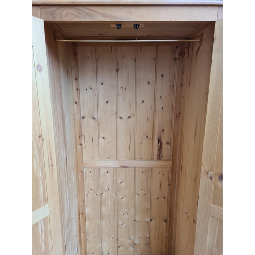 1069 - A modern solid pine double wardrobe - approx. 195cm high x 90cm wide x 56cm deep