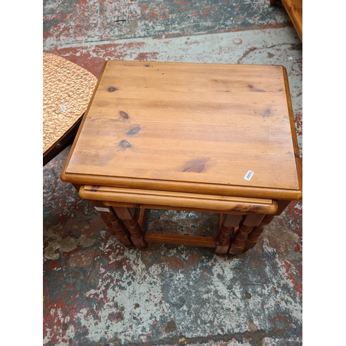 1070 - Two items, modern pine nest of three tables and vintage copper topped coffee table