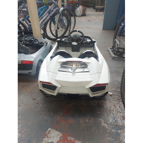 1219 - A white Lamborghini child's ride on electric car