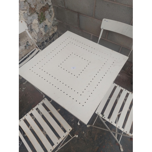 1232 - A five piece white painted metal folding patio set comprising table with square top and four matchin... 