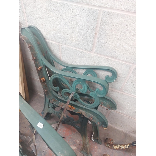 1237 - Two pairs of ornate green painted cast iron bench ends