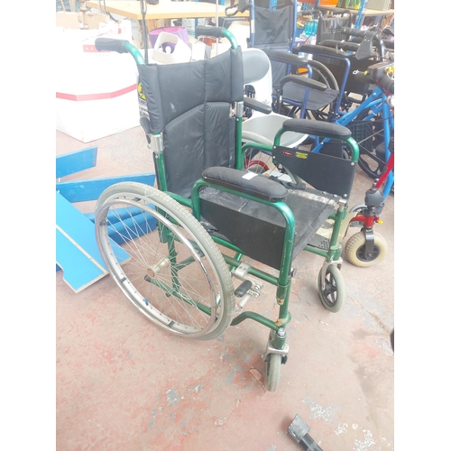 1245 - A black and green Enigma folding self-propelled wheelchair