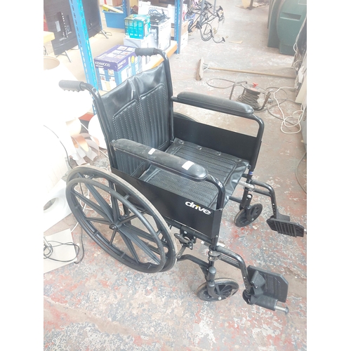 1247 - Two items, one Drive black self-propelled folding wheel chair and one blue Drive folding wheelchair ... 