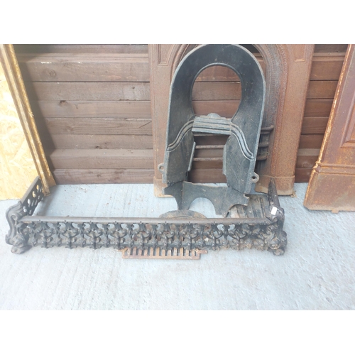 1259 - A complete vintage cast iron bedroom fireplace comprising surround with mantel piece, fire back with... 