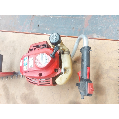 1271 - A red Shindaiwa HY230 petrol hedge trimmer with 29