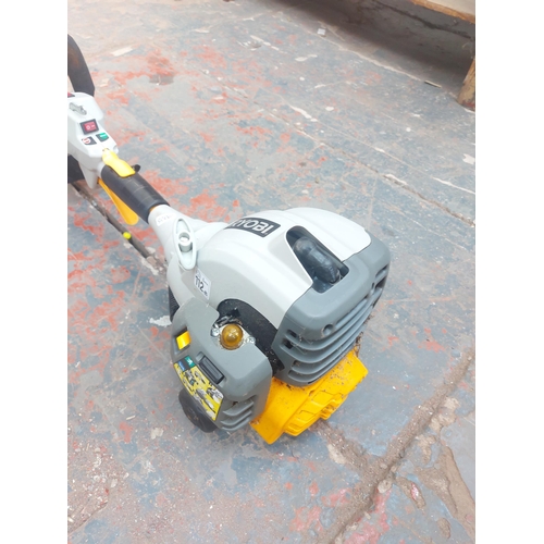 1273 - A grey and yellow Ryobi RBC30SET petrol strimmer