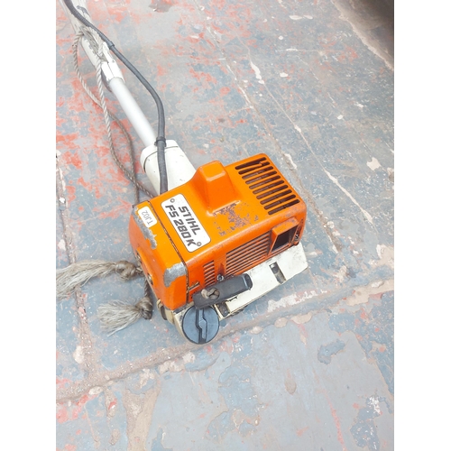 1274 - An orange and grey Stihl FS280K petrol strimmer