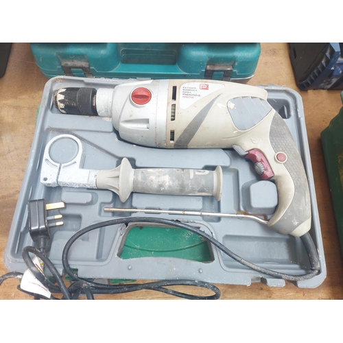 1289 - Two cased power tools, one grey performance power PHD1050-2 electric drill and one Mac Allister MSRH... 