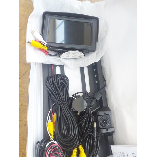 1304 - A boxed new Connex T Vision number plate surround mounted camera with 4.3