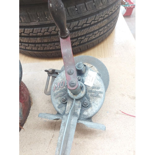 1318 - Two items, one red metal Alemite grease bucket with hand pump and one vintage mole clamp on manually... 