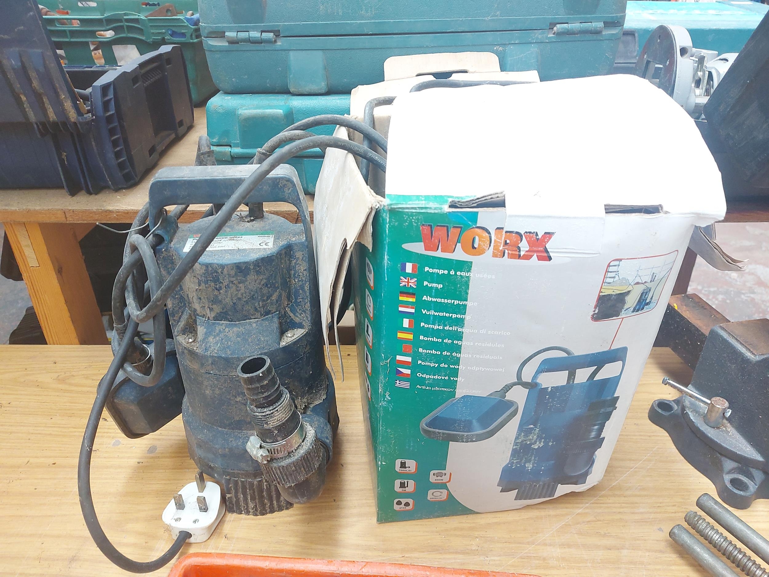 A boxed Worx 400 watt submersible pump