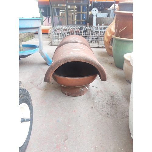 1355 - Two terracotta chimney pot cowlings