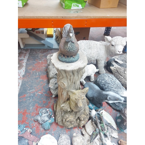 1366 - A collection of various cast stone, resin and plastic garden ornaments to include badgers, ducks, ra... 