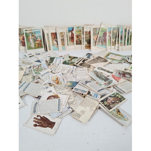 336 - A large collection of vintage cigarette cards to include two Senior Service card albums, Wills, John... 