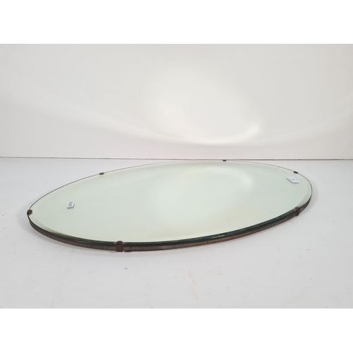 338 - A vintage bevelled edge oval wall mirror - approx. 69cm x 40cm