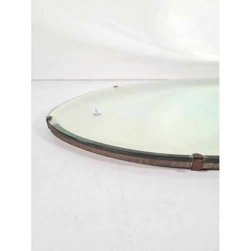 338 - A vintage bevelled edge oval wall mirror - approx. 69cm x 40cm