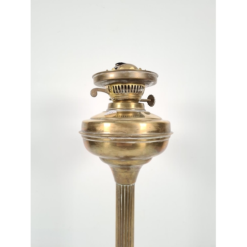 354 - A late 19th/early 20th century brass Corinthian column oil lamp with hardwood stand - approx. 52cm h... 