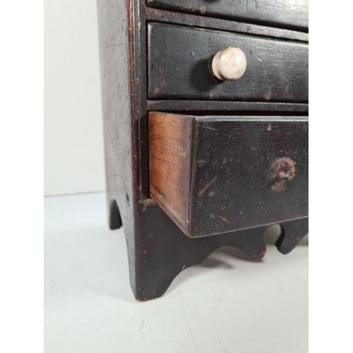 359 - A Victorian stained mahogany miniature apprentice chest of two short over four long drawers - approx... 