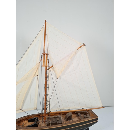 360 - A model wooden ship on stand with linen sails - approx. 56cm high x 63cm wide