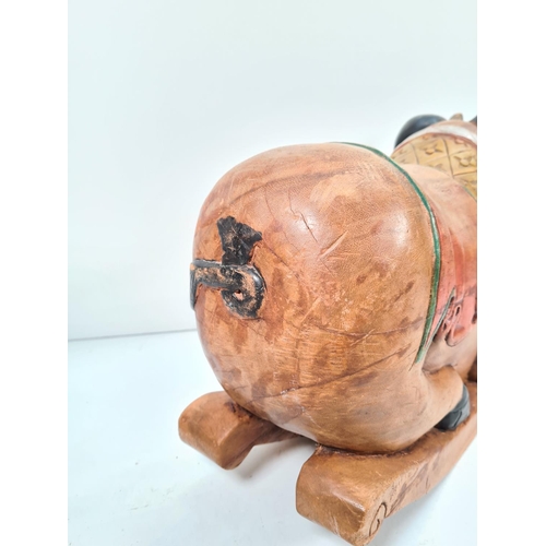 371 - A modern carved hardwood rocking pig - approx. 38cm high x 60cm long