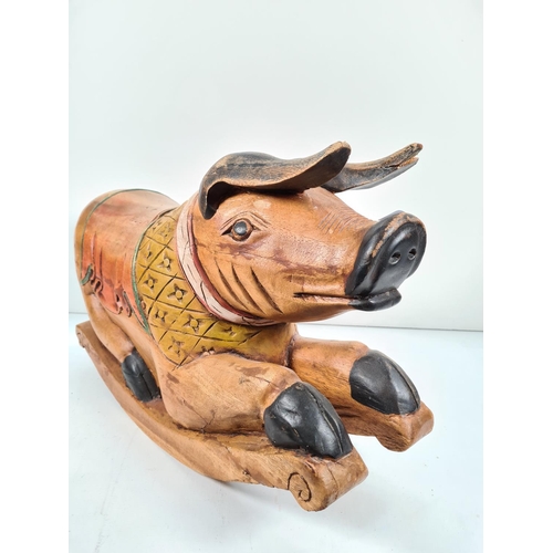 371 - A modern carved hardwood rocking pig - approx. 38cm high x 60cm long