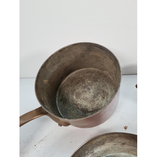 287 - Five pieces of vintage Helvetia copper kitchenware to include three lidded sauce pans and two frying... 