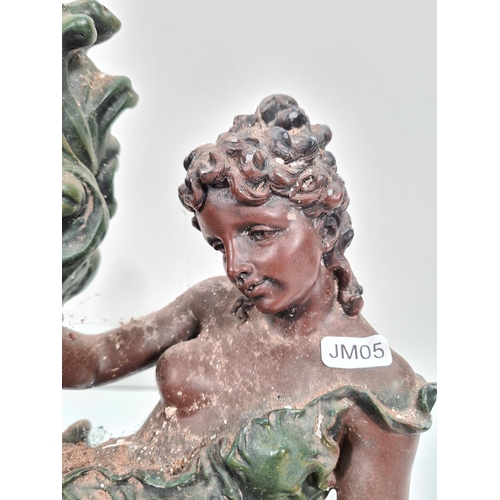 294 - A Juliana bronzed resin figural quartz mantel clock - approx. 35cm high x 43cm wide x 16cm deep